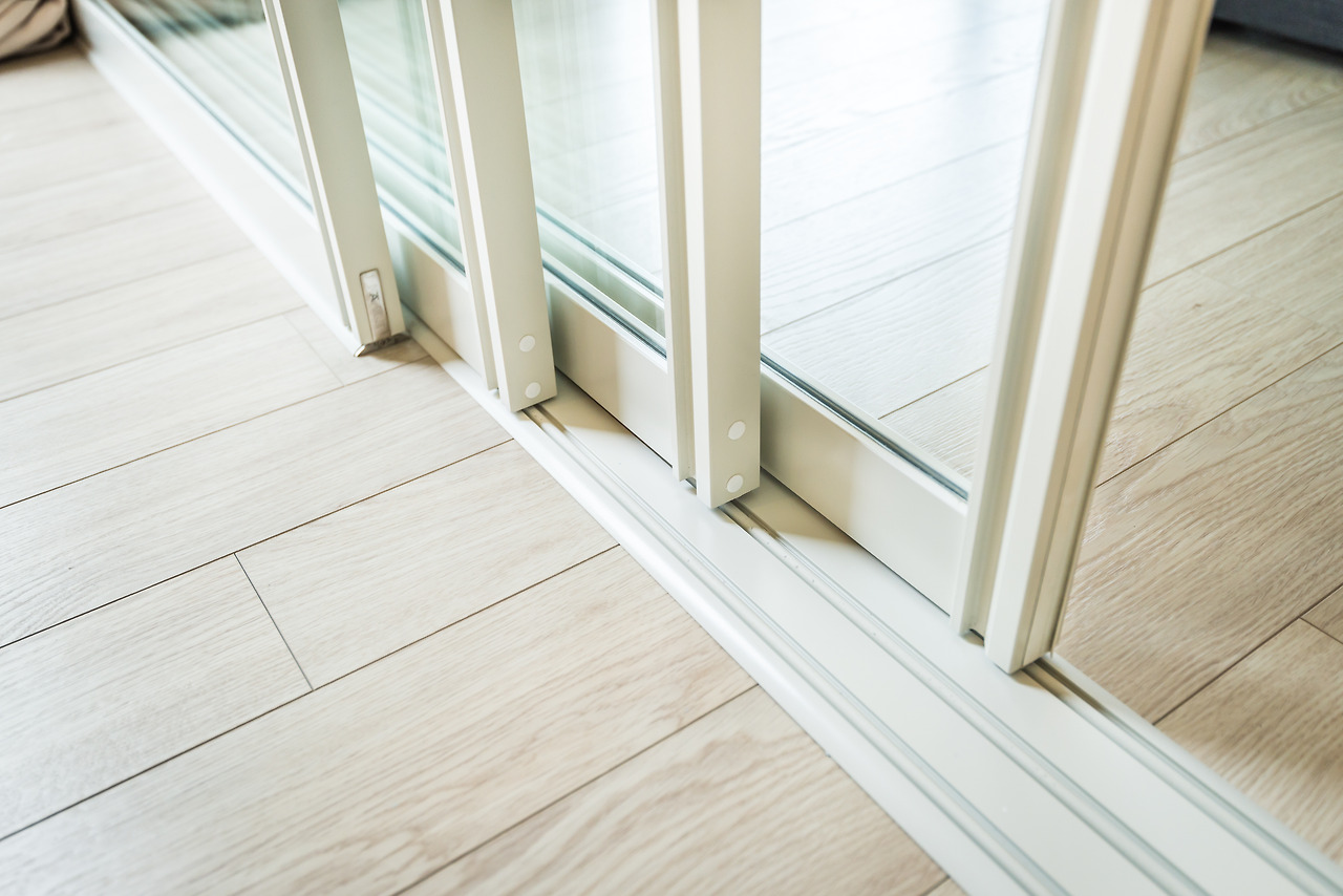 (85p-4) stock-photo-sliding-glass-door-detail-and-rail-embed-in-wooden-floor-302916335.jpg