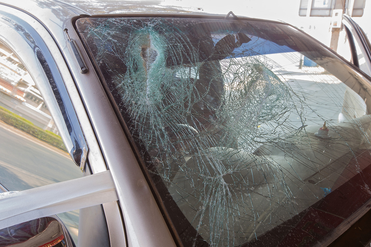 (107p-1) stock-photo-broken-car-windshield-from-outside-the-car-592481435.jpg