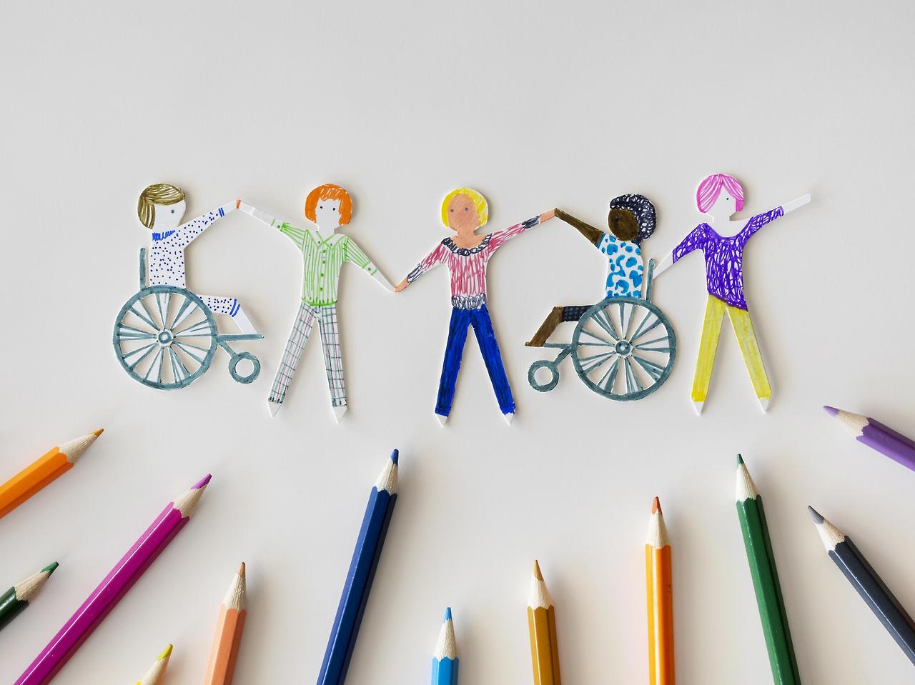 multi-ethnic-disabled-people-community-with-pencils.jpg