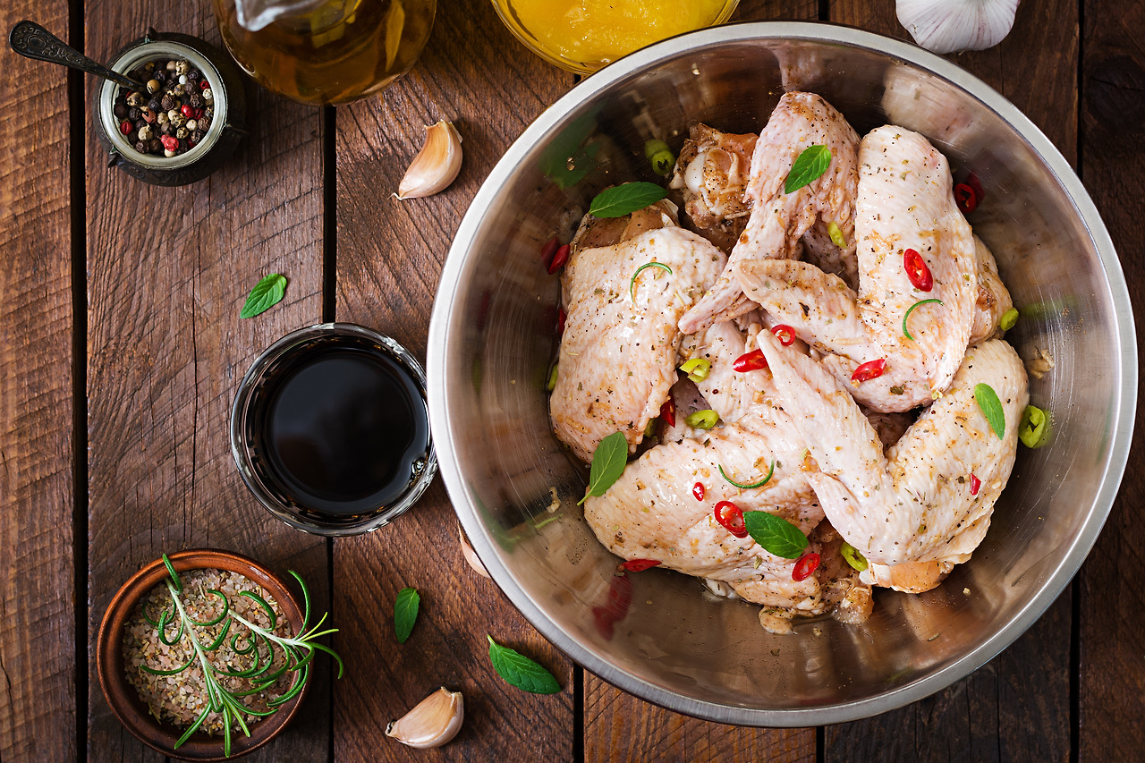 raw-marinated-chicken-wings-prepared-asian-style-with-honey-garlic-soy-sauce-herbs-top-view.jpg