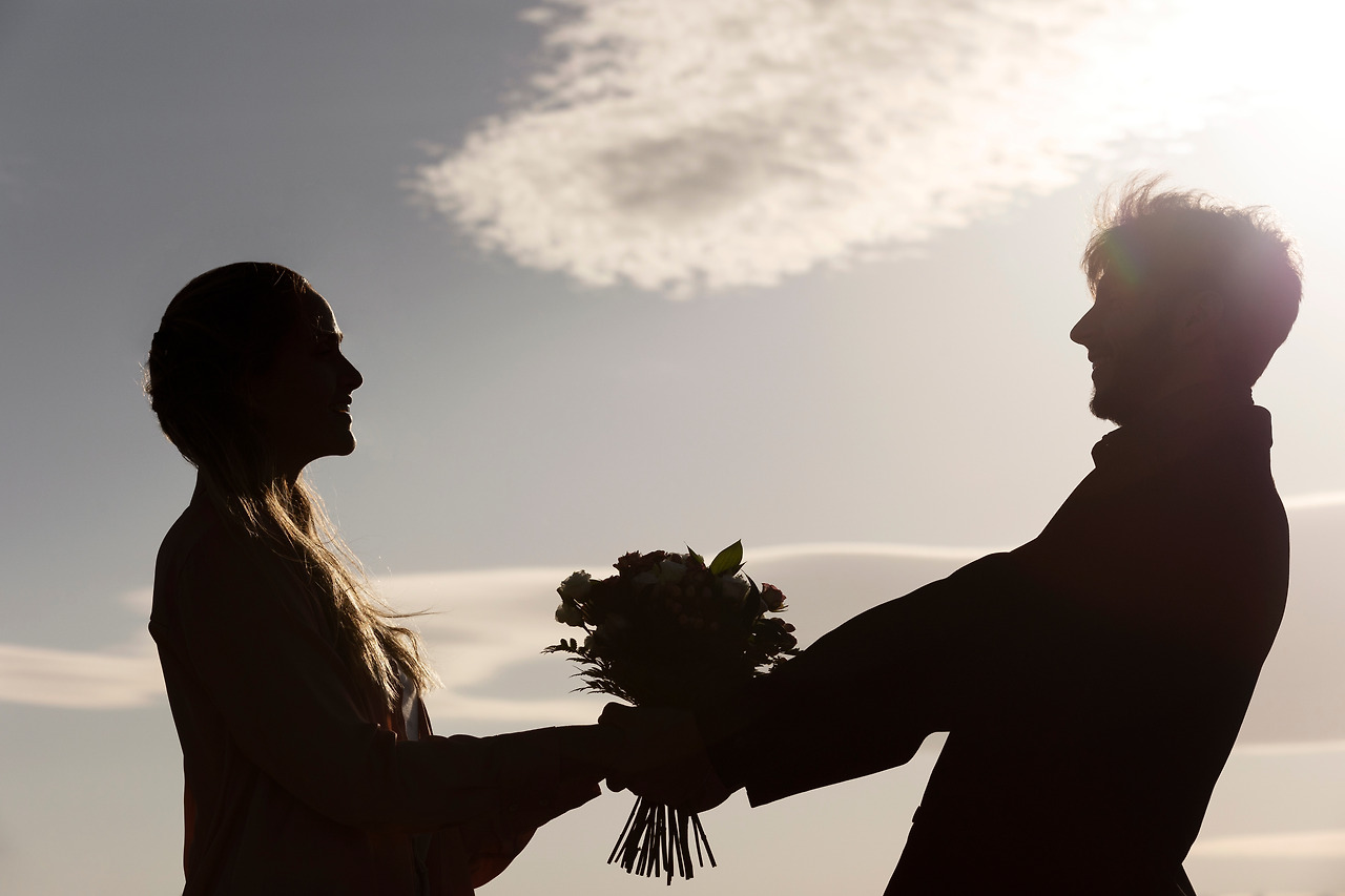 side-view-romantic-couple-with-flowers-bouquet.jpg