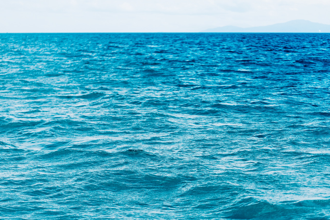 bright-blue-ocean-with-smooth-wave-background.jpg