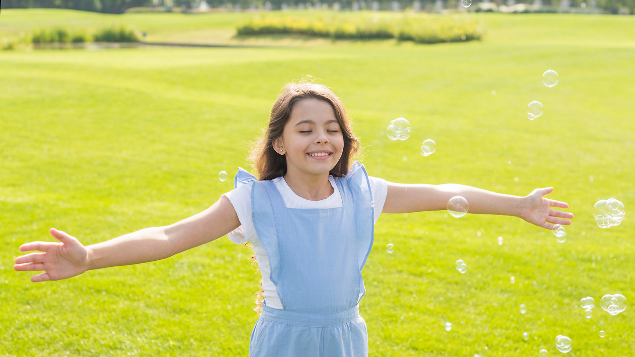 medium-shot-cheerful-girl-playing-with-soap-bubbles.jpg