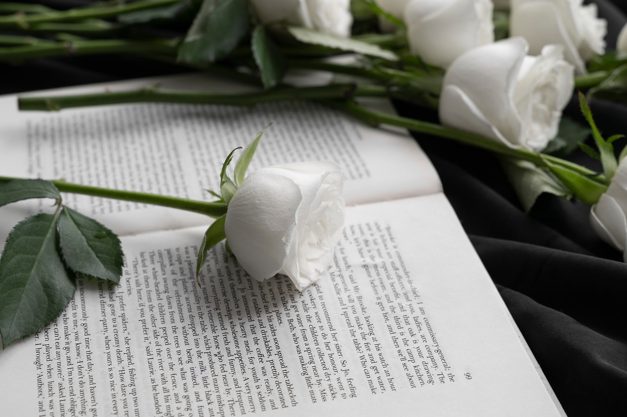 view-delicate-white-roses-with-book.jpg