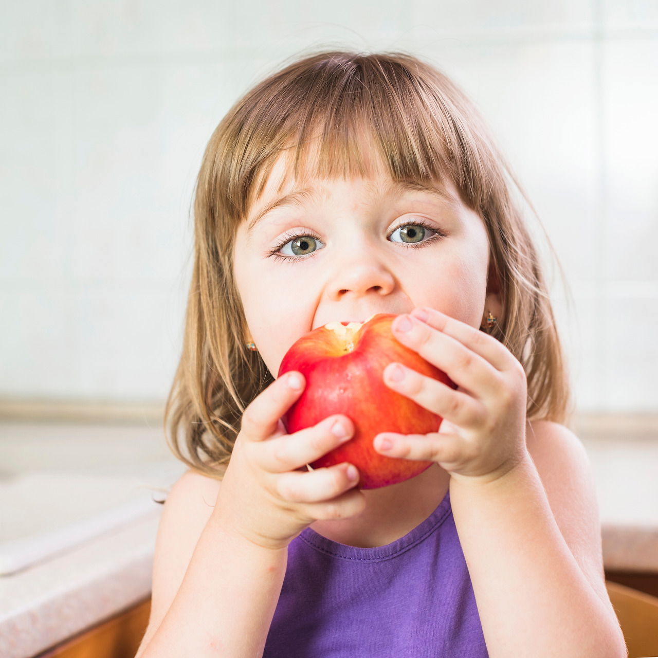 portrait-cute-girl-eating-ripe-red-apple.jpg