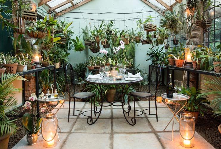 The-Safari-Collection-romantic-orchid-house-dinner-set-up-awaits-guests-at-giraffe-manor.jpg