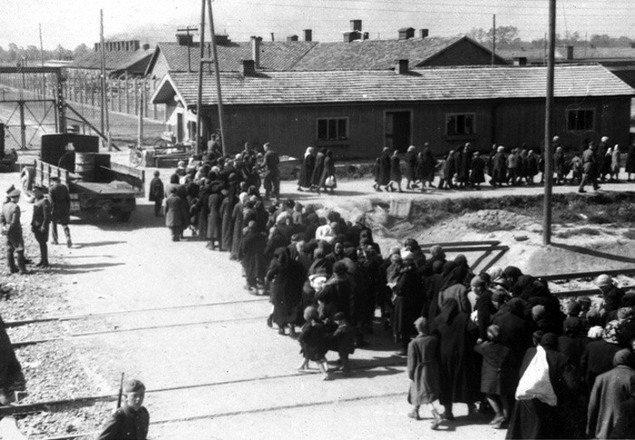 march-of-new-arrivals-along-the-ss-barracks-at-birkenau-toward-the-gassing-bunker-near-crematoria-ii-and-iii-27-may-1944.jpg