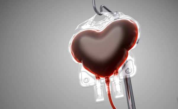 Heart_shaped_blood_bag_for_a_blood_transfusion_on_a_grey_background.jpg