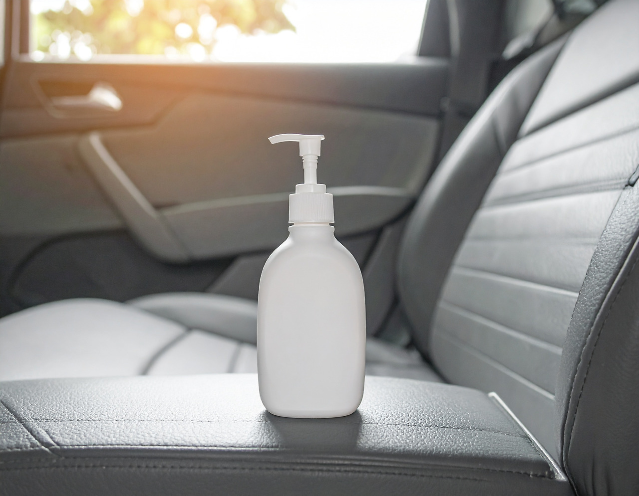 Firefly_There is a bottle of lotion on the passenger seat of the car. 761762.jpg