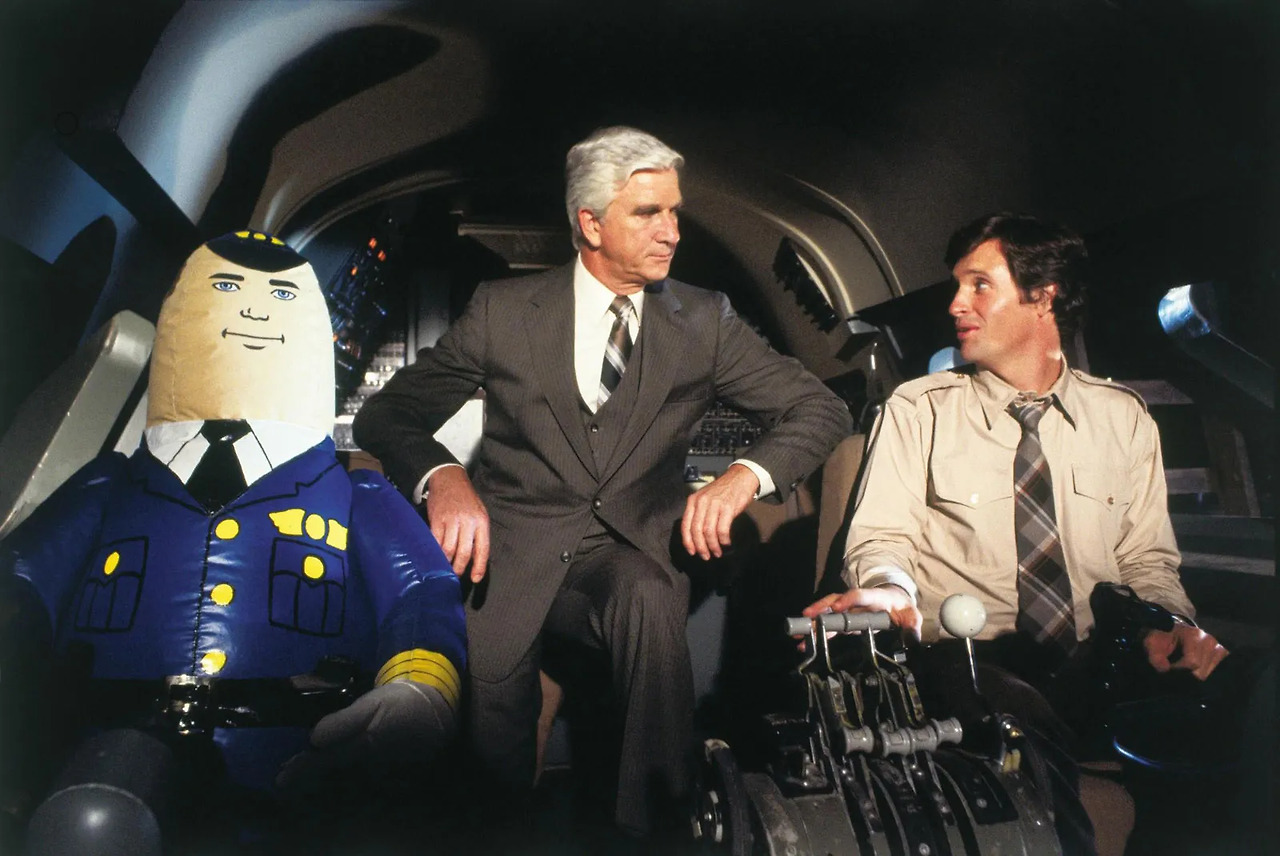 Publicity-still-Airplane-movie-1980-Roberty-Hays-Leslie-Nielsen.jpg