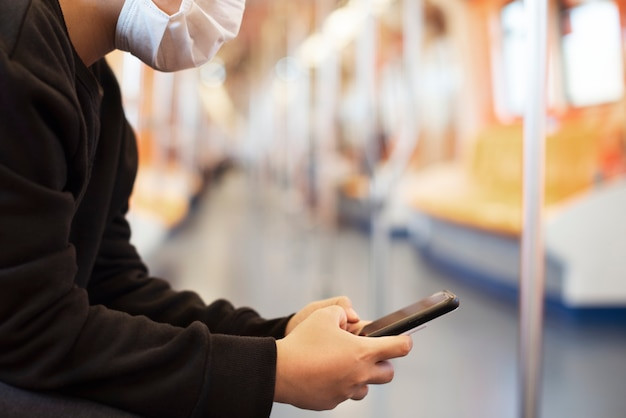 woman-using-phone-empty-train-coronavirus-pandemic_53876-94739.jpg
