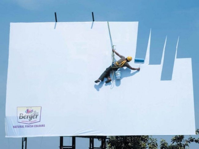 Berger-Paints-Advertisement-Featuring-a-Man-Painting-the-Billboard-with-Skyblue.jpg