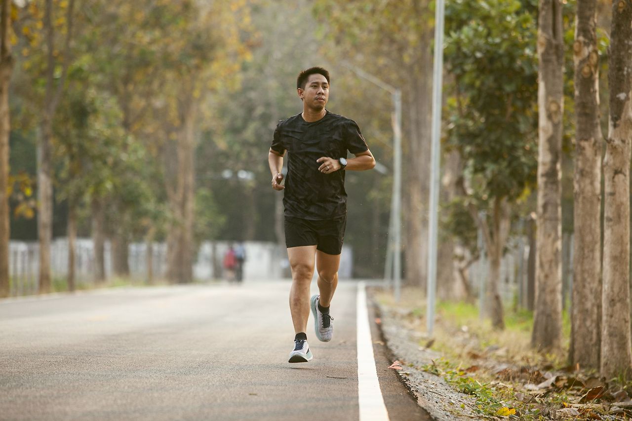 asian-sportman-jogging-and-checking-smart-watch-royalty-free-image-163850163.jpg
