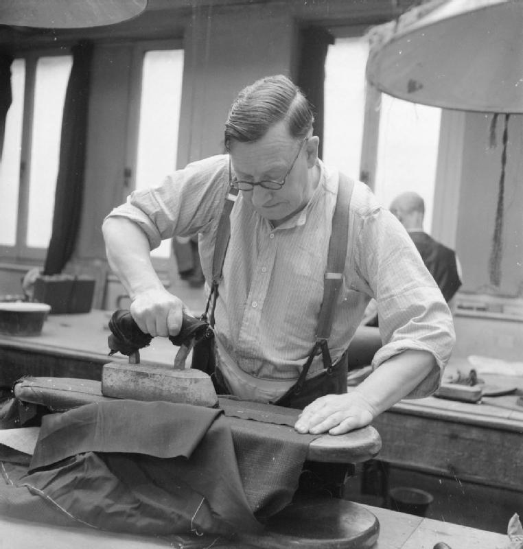Savile_Row-_Tailoring_at_Henry_Poole_and_Co.,_London,_England,_UK,_1944_D21865.jpg