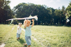 Free Photo _ Cute little child in a summer field with a kite.jpg