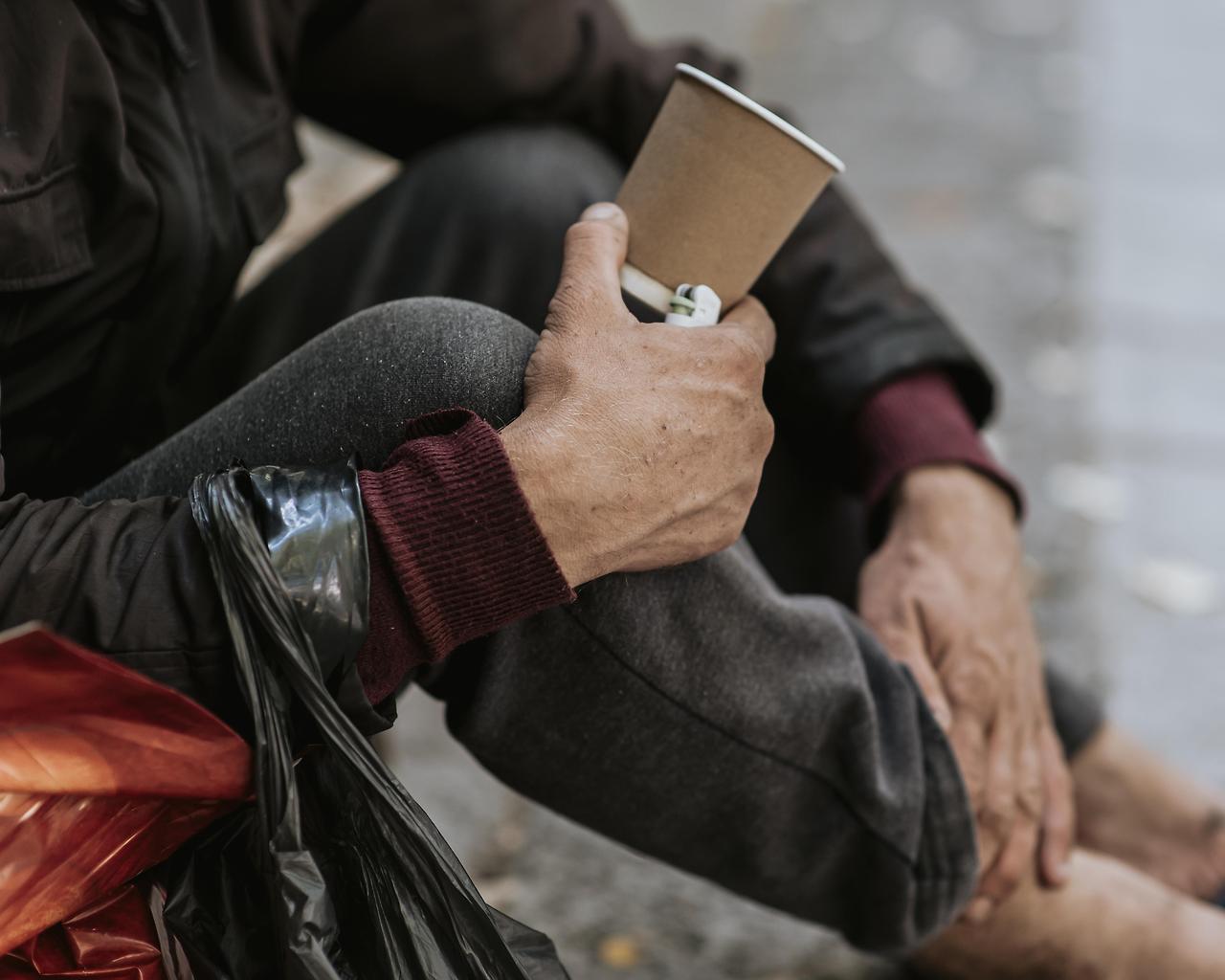 side-view-homeless-man-holding-cup.jpg