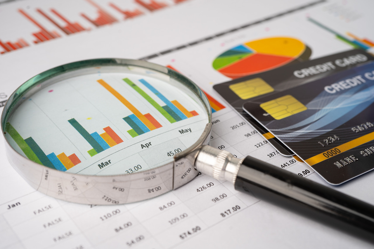 vecteezy_credit-card-with-magnifying-glass-on-chart-and-graph-paper-finance-development-banking-account-statistics-investment-analytic-research-data-economy-stock-exchange-trading-business-company_2761012.jpg