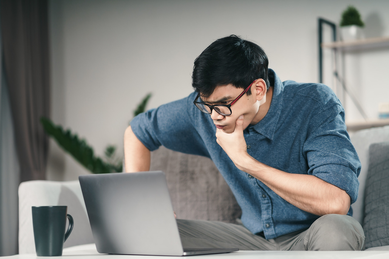 vecteezy_pensive-thoughtful-serious-asian-man-in-eyeglasses-looking-at-laptop-screen-thinking-for-solution-to-solve-the-problem_2910479.jpg