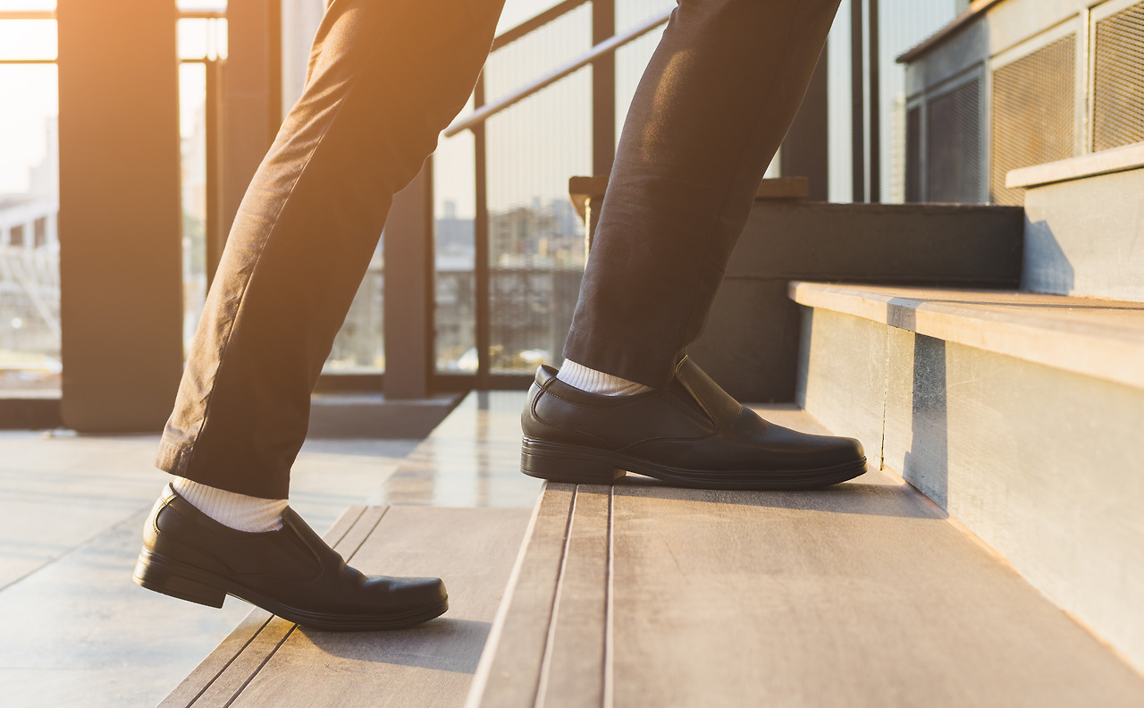 vecteezy_business-people-walking-up-the-stairs_3378093.jpg