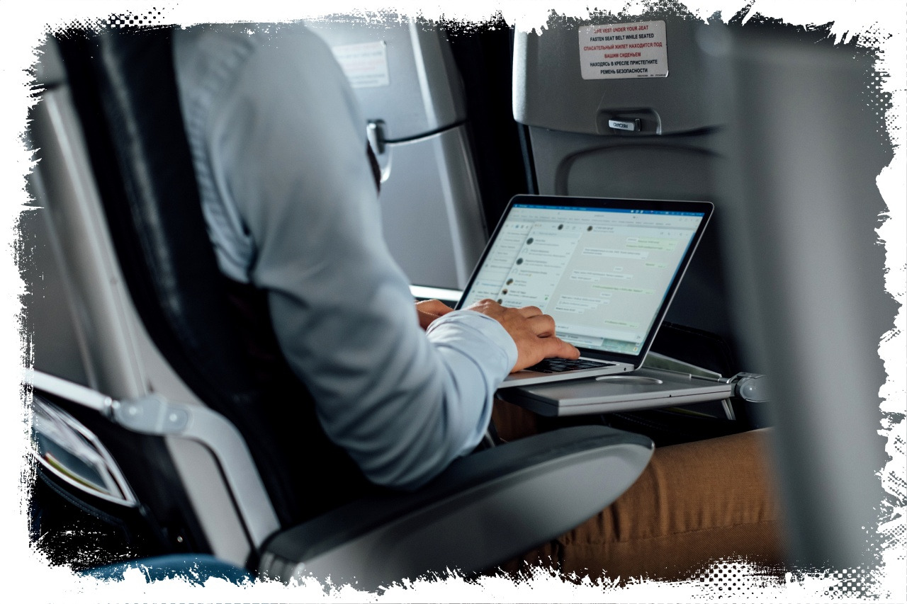 young-man-working-with-computer-on-the-plane.jpg