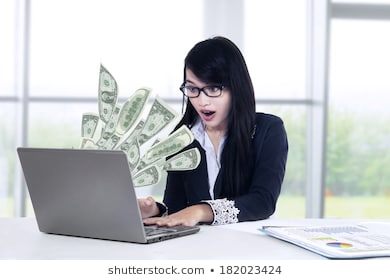 young-businesswoman-laptop-money-great-260nw-182023424.jpg