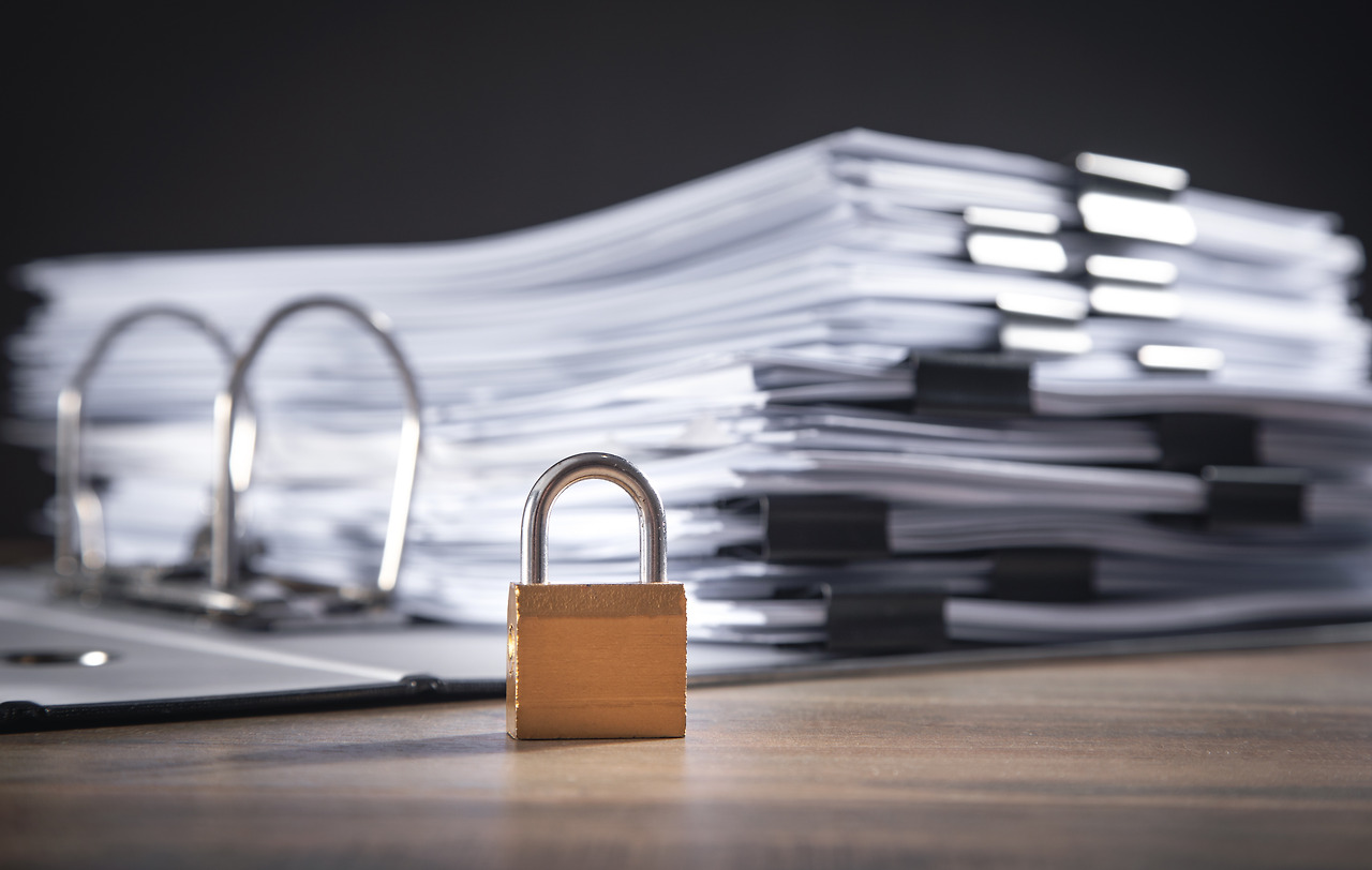 files-documents-with-padlock-wooden-table-data-security.jpg