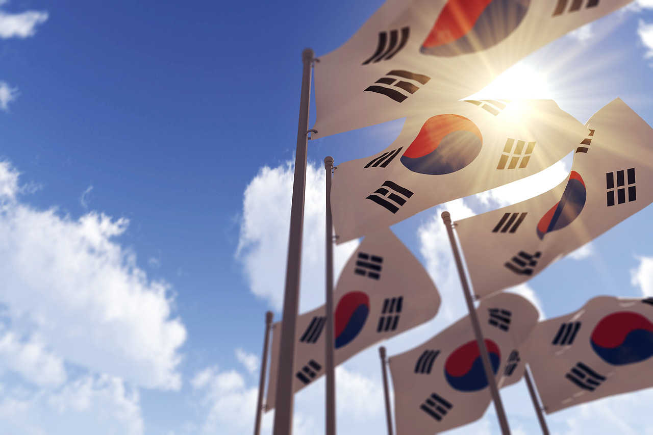 south-korea-flags-waving-wind-against-blue-sky-d-rendering.jpg