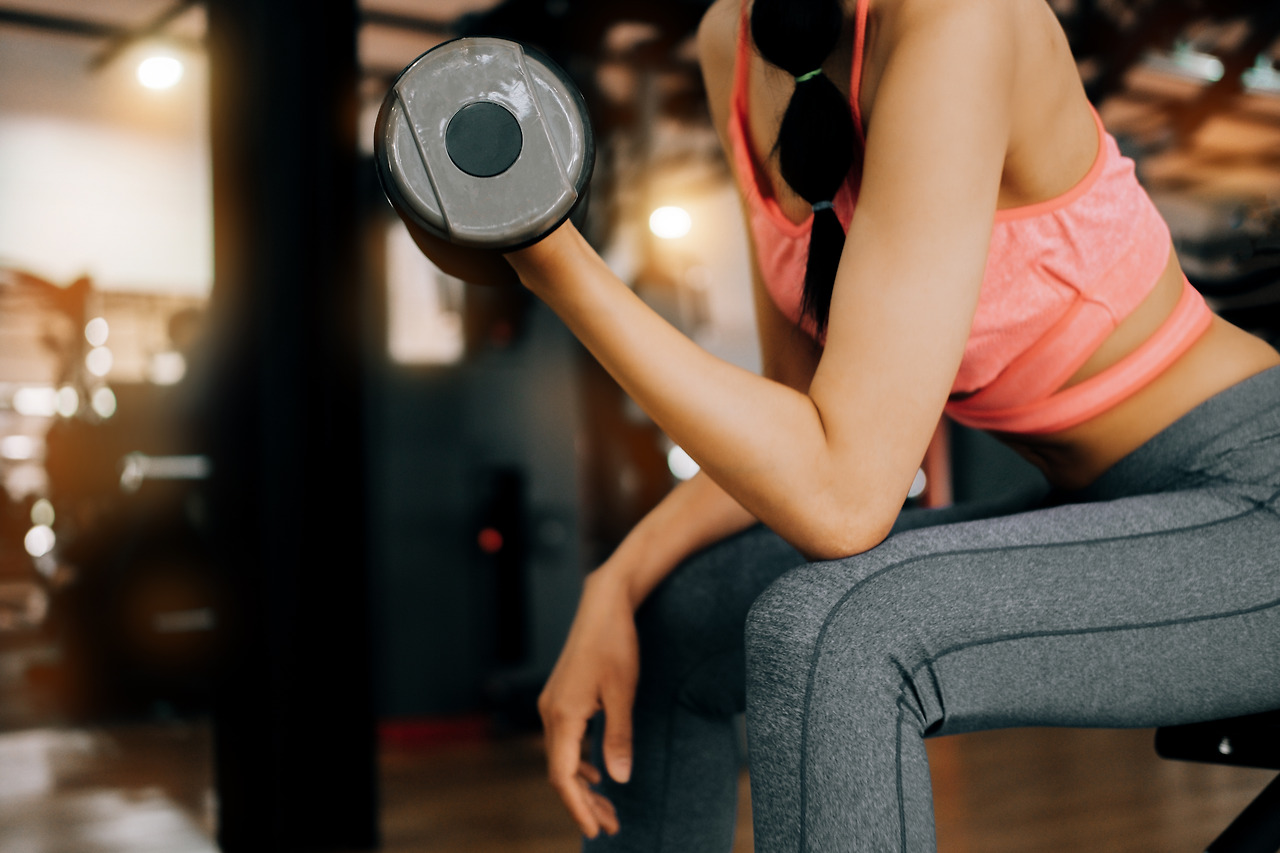 woman-lifting-dumbbell-gym.jpg