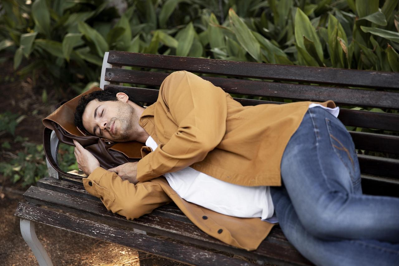 medium-shot-man-sleeping-bench.jpg