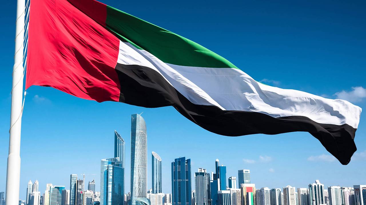 content--abu-dhabi-skyline-with-uae-flag-116052247--istockfranckreporter.jpg