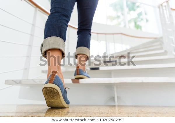 young-adult-woman-walking-stairs-600w-1020758239.jpg