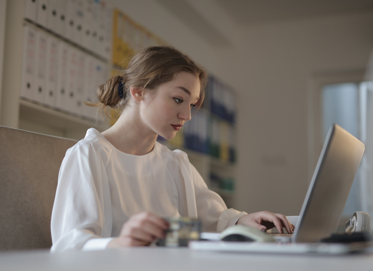 woman-in-white-long-sleeve-shirt-using-a-laptop-3784337.jpg