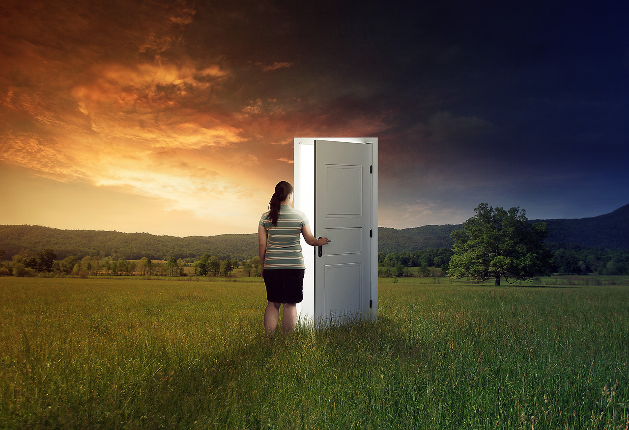 woman-walking-through-a-door-in-the-field_HmwghCbxC.jpg