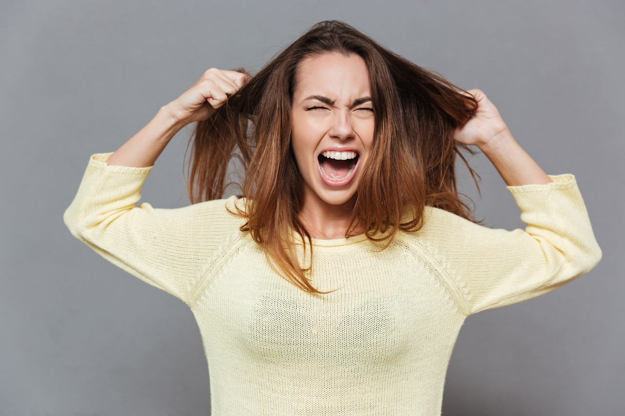 graphicstock-portrait-of-a-frustrated-angry-woman-screaming-out-loud-and-pulling-her-hair-out-isolated-on-the-gray-background_BdQaiAyv2l.jpg