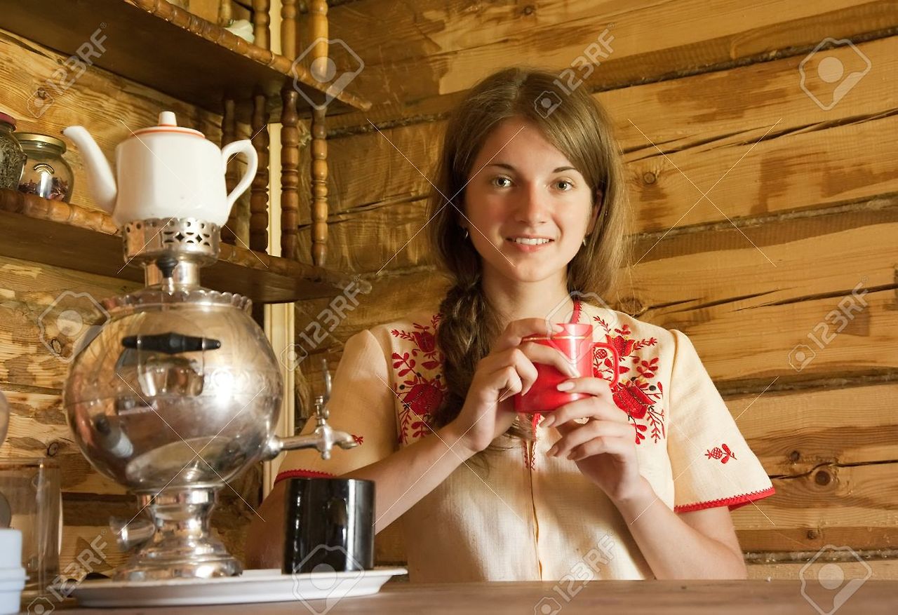 1.7465085-Girl-with-traditional-russian-samovar-in-inter--Stock-Photo.jpg