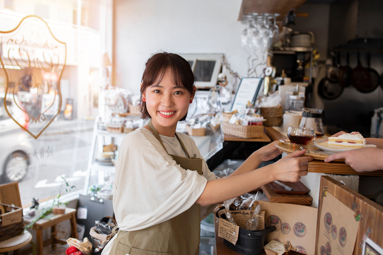 young-woman-arranging-her-cake-shop.jpg