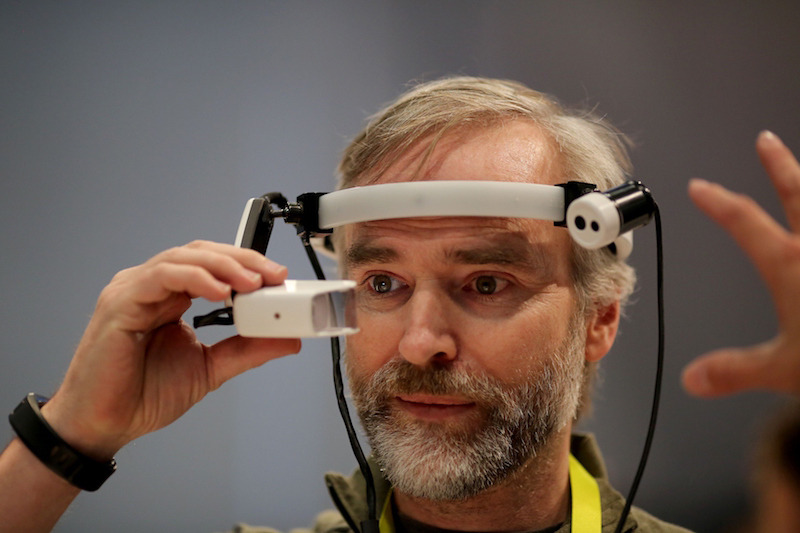 Dylan-Hixon-tries-out-a-augmented-reality-system-for-business-communications-under-development-by-Ricoh.jpg