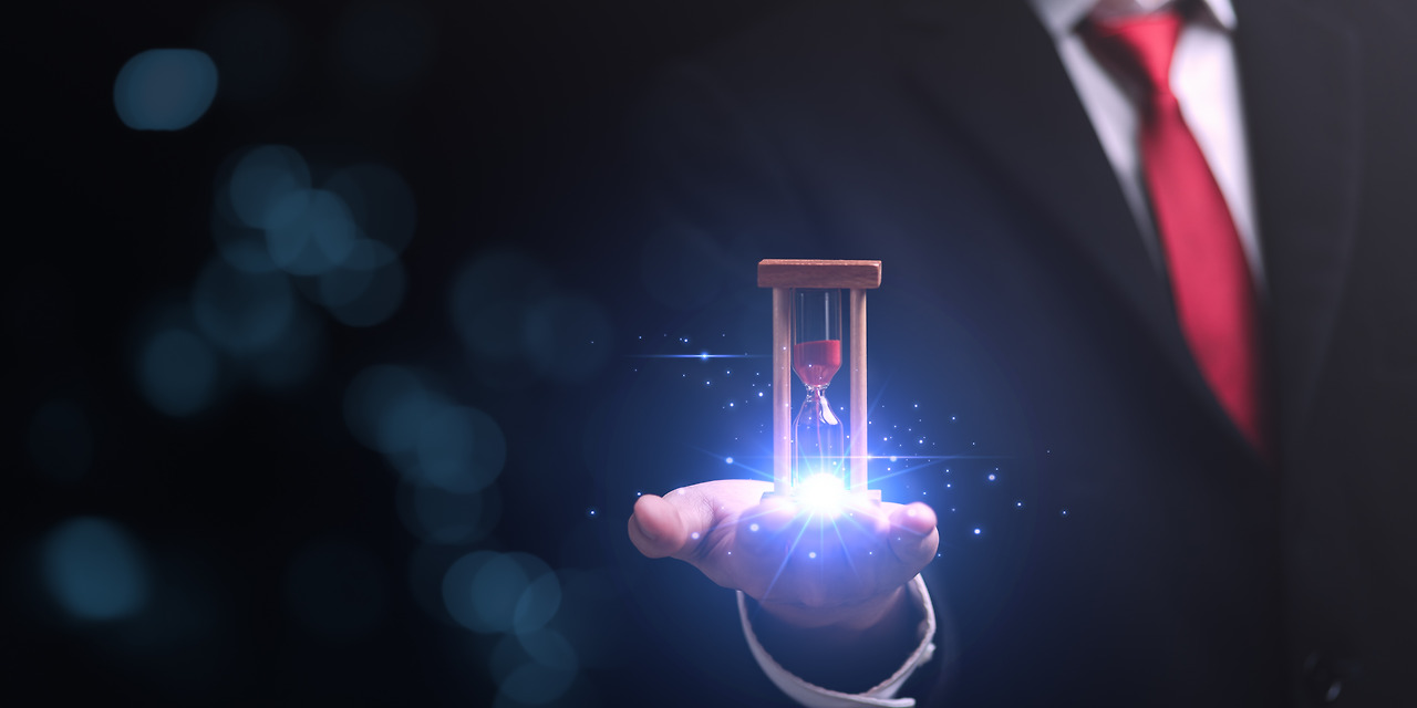 vecteezy_hourglass-on-businessman-hand-time-management-concept_26398879 (1).jpg