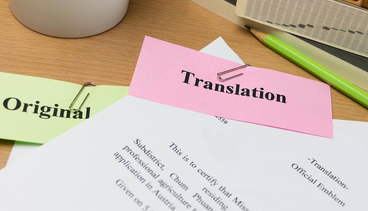 vecteezy_translation-paper-on-wooden-table_10756229.jpg