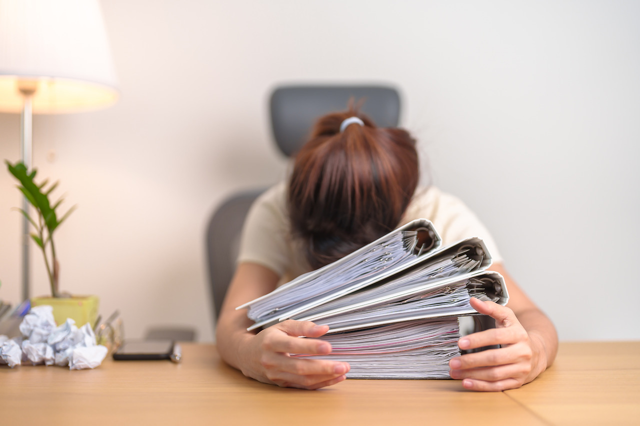 vecteezy_stressed-asian-woman-having-tired-and-sleepy-while-working_53916899.jpg