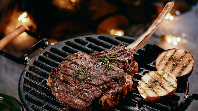 the-bone-helps-insulate-the-tomahawk-steak-while-cooking-1648832710.jpg