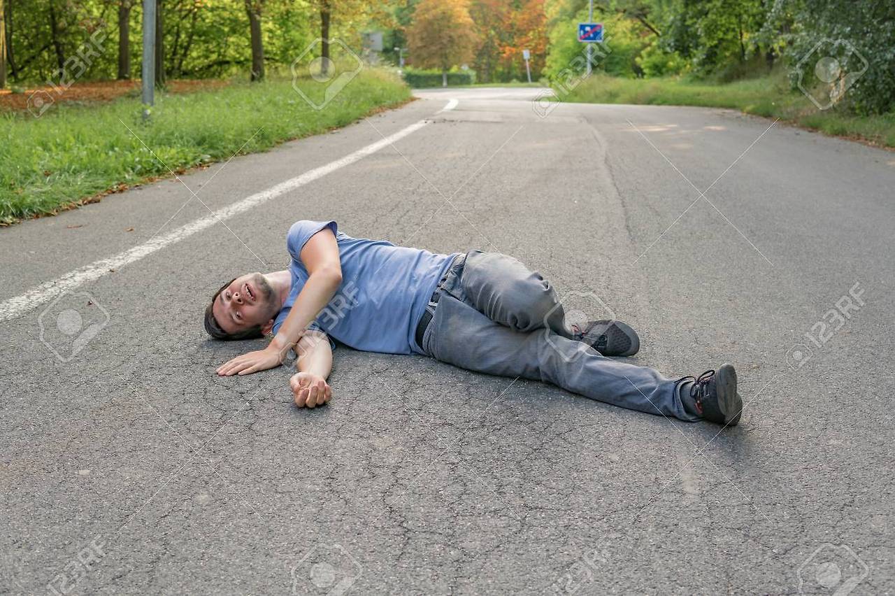 96942651-injured-man-had-an-accident-and-is-lying-on-road.jpg
