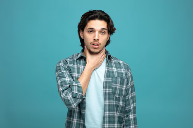 aching-young-handsome-man-looking-camera-while-keeping-hand-neck-having-sore-throat-isolated-blue-background_141793-136873.jpg