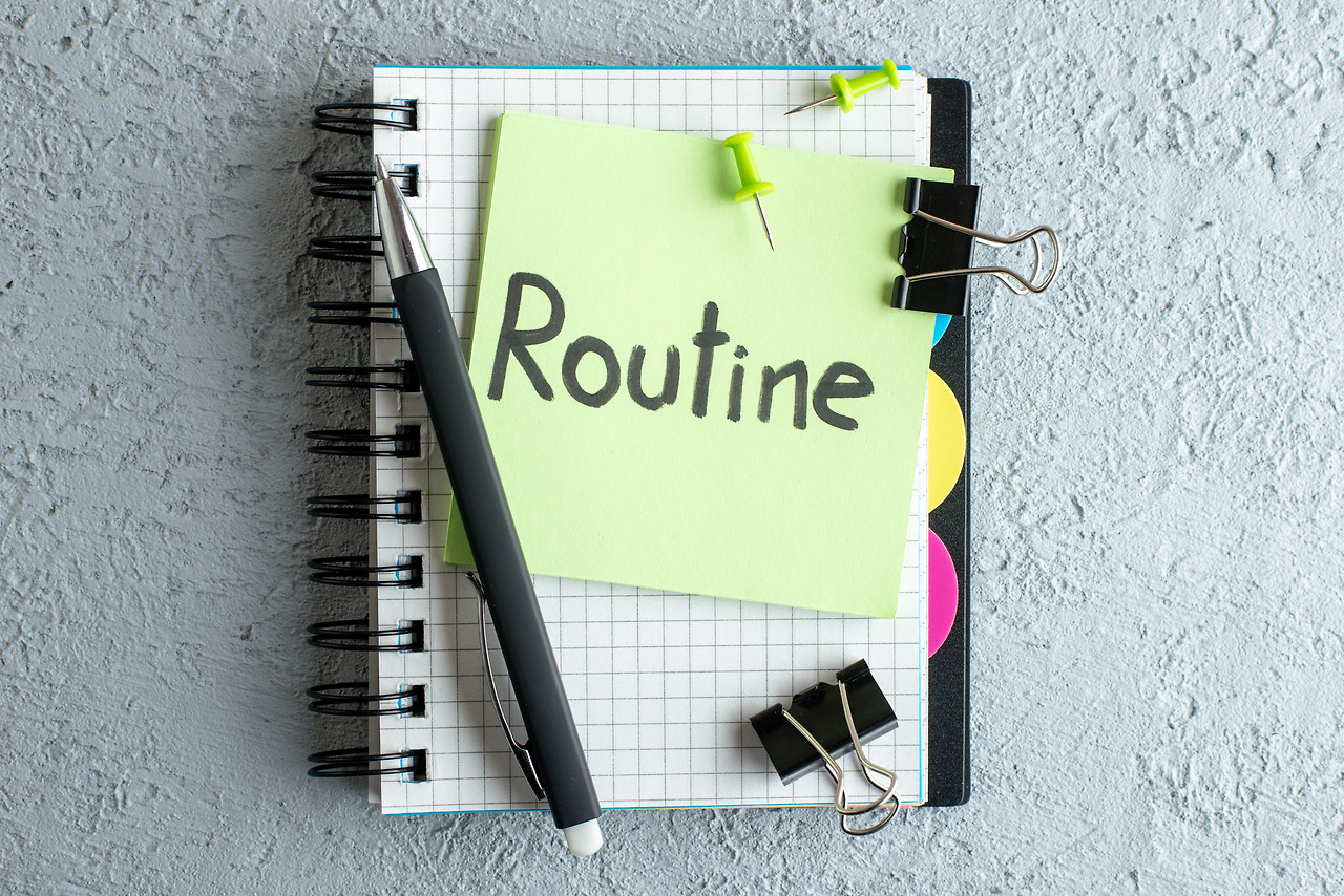 top-view-routine-written-note-green-sticker-with-notepad-pen-white-background-color-job-office-school-copybook-college-business.jpg
