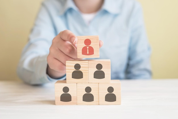 human-resource-management-and-recruitment-business-team-concept-hand-putting-wood-cube-block-on-top-pyramid_357889-3185.jpg