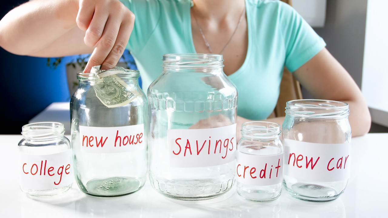 14851017_MotionElements_young-woman-saving-money.jpg
