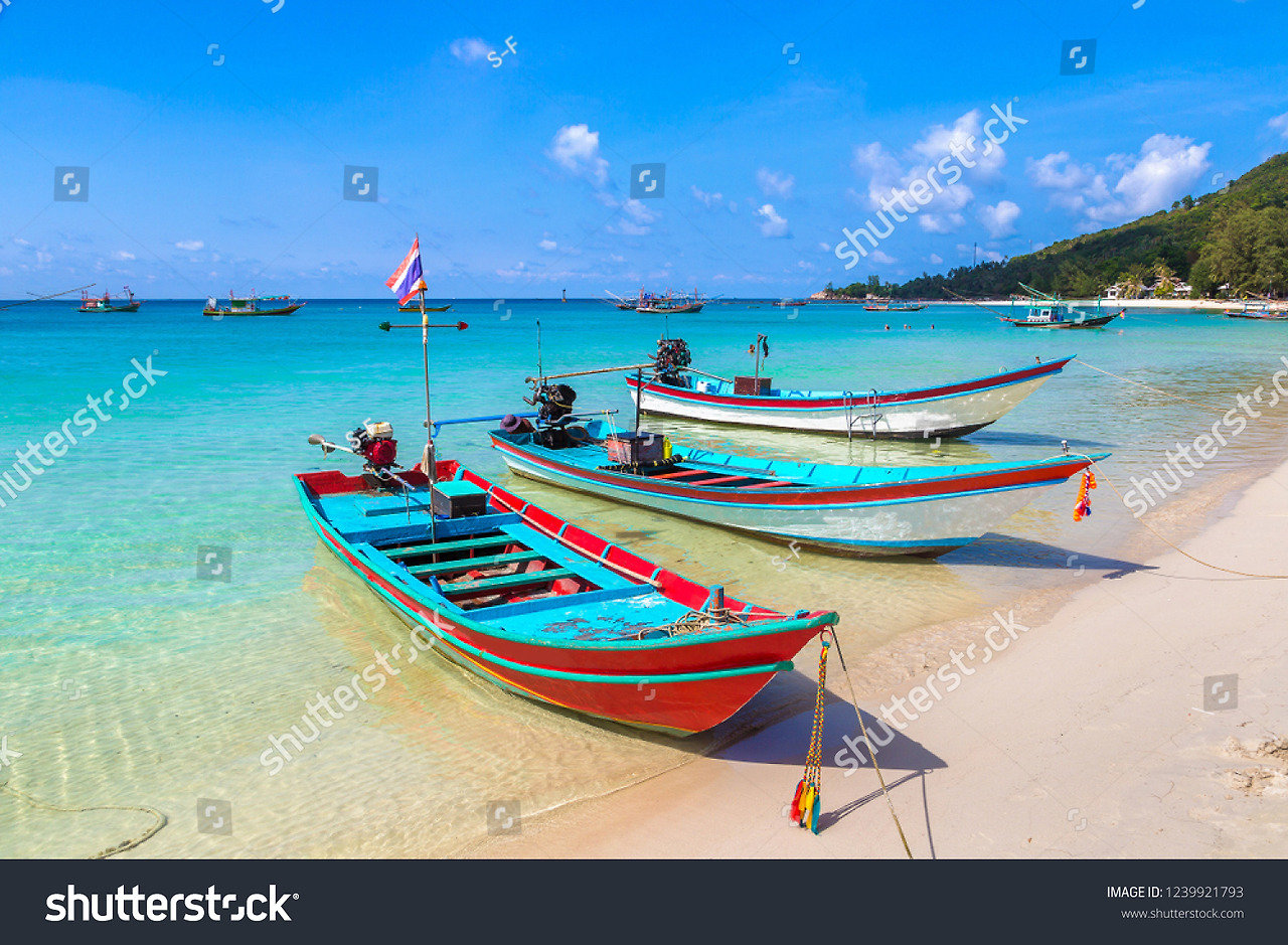 stock-photo-traditional-wooden-fisherman-boat-on-koh-phangan-island-thailand-in-a-summer-day-1239921793.jpg
