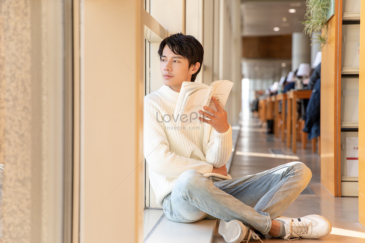 lovepik-male-sitting-on-library-floor-and-reading-book-picture_501542560.jpg
