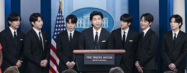 640px-BTS_during_a_White_House_press_conference_May_31,_2022_(cropped).jpg