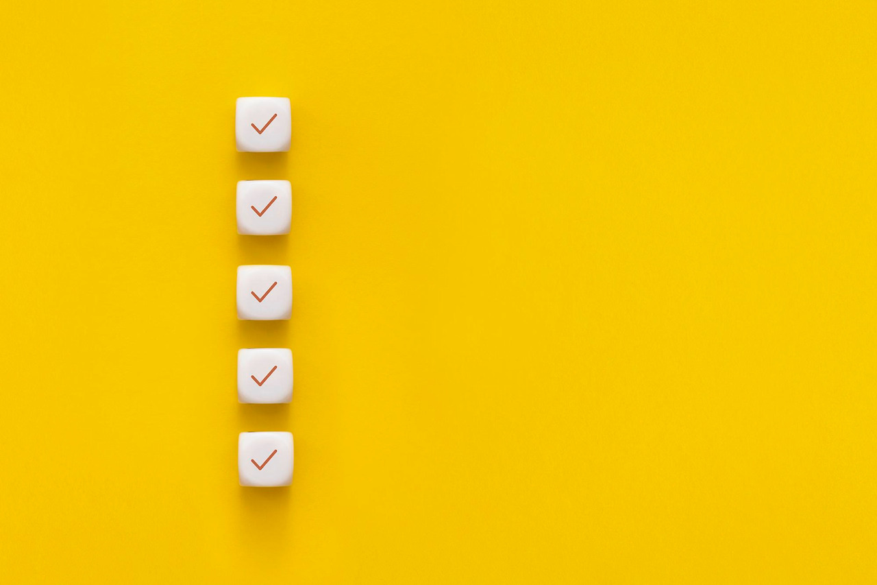 subes-with-check-mark-yellow-background-checklist-concept-with-copy-space.jpg
